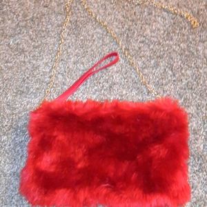 Red cross body bag or it can be a wristlet.